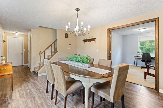 998 Timberbank Dr, Westerville, OH 43081 - dining space featuring wood finished floors, a textured ceiling, stairs, a chandelier, and baseboards