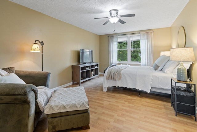 998 Timberbank Dr, Westerville, OH 43081 - bedroom with light wood finished floors, baseboards, a textured ceiling, and a ceiling fan