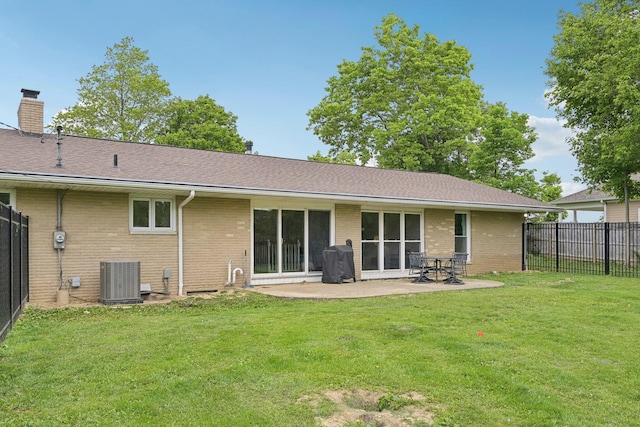 385 Taylor Blair Rd, West Jefferson, OH 43162 - rear view of house featuring central air condition unit, brick siding, a patio area, a chimney, and roof with shingles