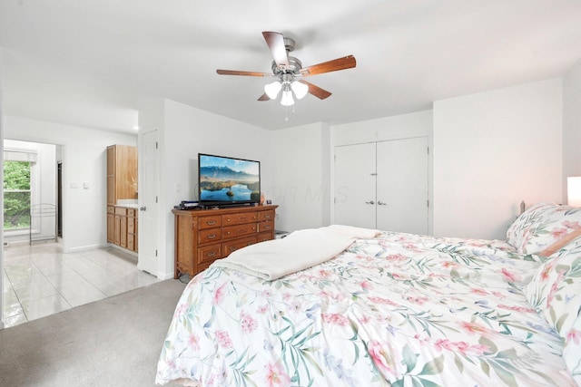 385 Taylor Blair Rd, West Jefferson, OH 43162 - bedroom featuring a closet, light colored carpet, ceiling fan, and light tile patterned floors