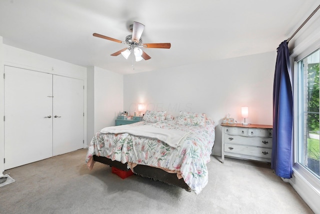 385 Taylor Blair Rd, West Jefferson, OH 43162 - carpeted bedroom featuring multiple windows, ceiling fan, and a closet