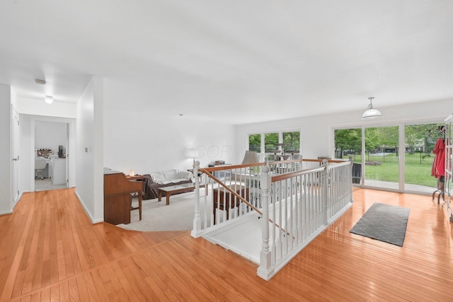 385 Taylor Blair Rd, West Jefferson, OH 43162 - hallway with light wood-style floors, an upstairs landing, and baseboards