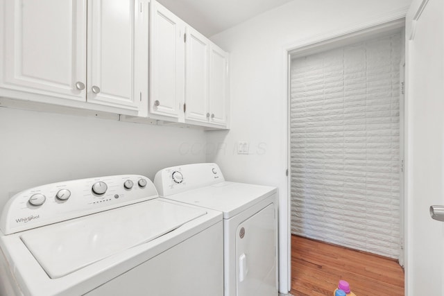 385 Taylor Blair Rd, West Jefferson, OH 43162 - laundry room featuring independent washer and dryer, light wood-type flooring, and cabinet space