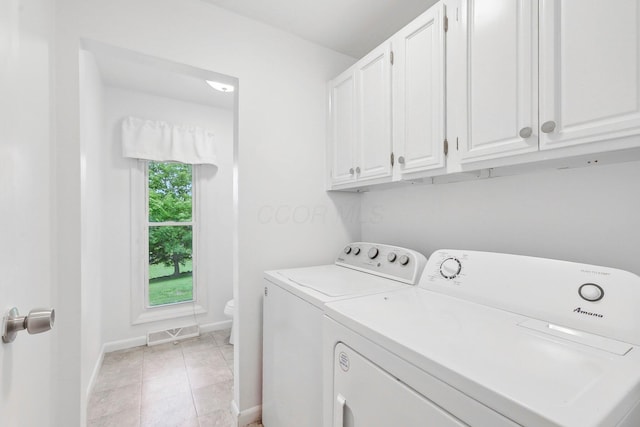 385 Taylor Blair Rd, West Jefferson, OH 43162 - laundry room featuring washing machine and clothes dryer, baseboards, and light tile patterned flooring