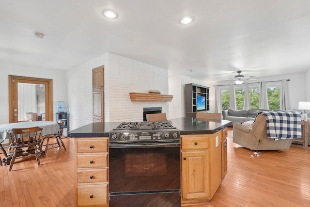 385 Taylor Blair Rd, West Jefferson, OH 43162 - kitchen featuring range with gas cooktop, dark countertops, and light wood-style flooring