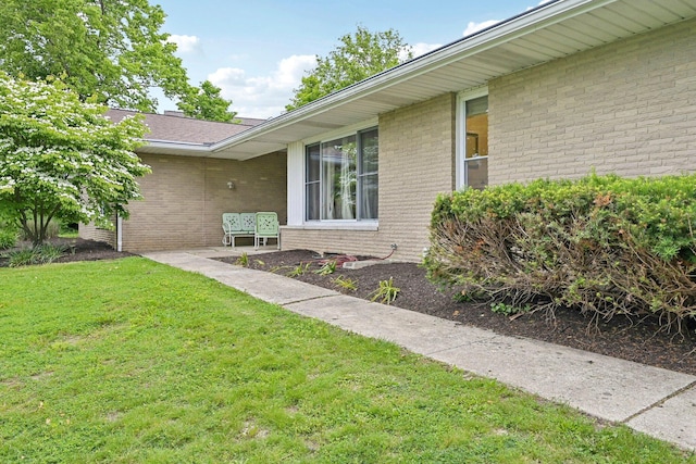 385 Taylor Blair Rd, West Jefferson, OH 43162 - doorway to property with brick siding and a lawn