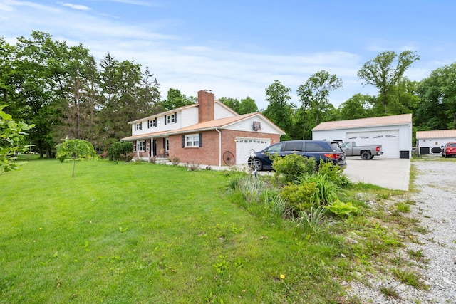 4736 Roberts Rd, Caledonia, OH 43314 - view of property exterior with a lawn, brick siding, a chimney, and a garage