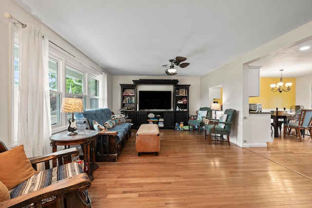 4736 Roberts Rd, Caledonia, OH 43314 - living area with wood finished floors, a chandelier, and ceiling fan