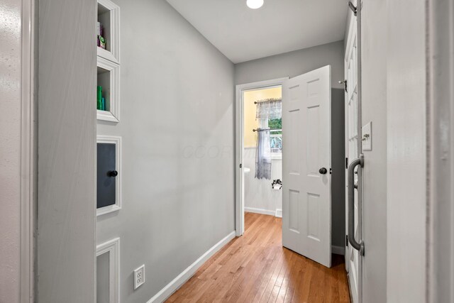 4736 Roberts Rd, Caledonia, OH 43314 - corridor with light wood-style flooring and baseboards