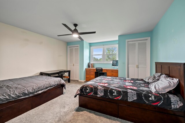 4736 Roberts Rd, Caledonia, OH 43314 - bedroom with two closets, light colored carpet, and a ceiling fan