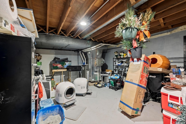 4736 Roberts Rd, Caledonia, OH 43314 - unfinished below grade area featuring heating unit and concrete block wall