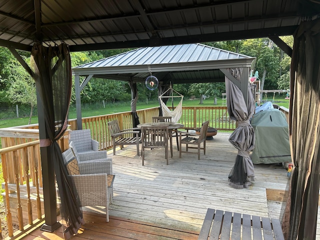 4736 Roberts Rd, Caledonia, OH 43314 - wooden terrace with a gazebo, outdoor dining area, and a lawn