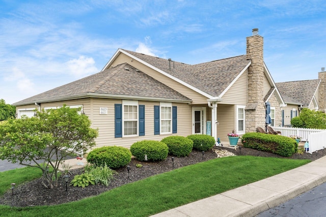 6621 Eagle Ridge Ln Unit 9C, Canal Winchester, OH 43110 - view of front of property with a shingled roof and a chimney