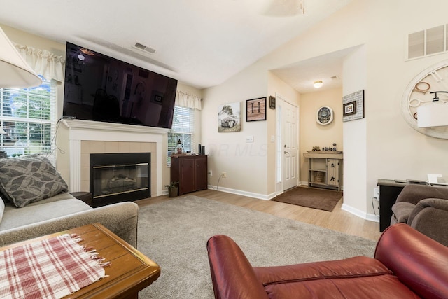6621 Eagle Ridge Ln Unit 9C, Canal Winchester, OH 43110 - living room featuring vaulted ceiling, wood finished floors, a fireplace, and baseboards