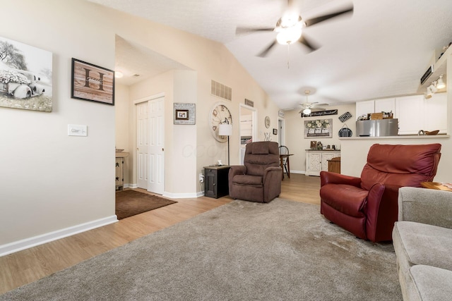 6621 Eagle Ridge Ln Unit 9C, Canal Winchester, OH 43110 - living room with ceiling fan, wood finished floors, vaulted ceiling, and baseboards
