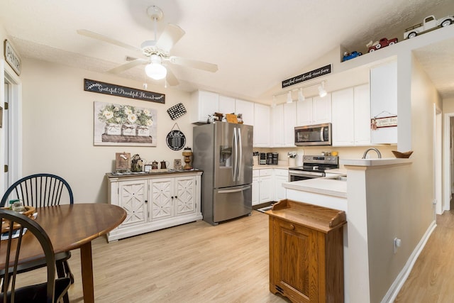 6621 Eagle Ridge Ln Unit 9C, Canal Winchester, OH 43110 - kitchen featuring appliances with stainless steel finishes, light wood finished floors, white cabinetry, a ceiling fan, and light countertops