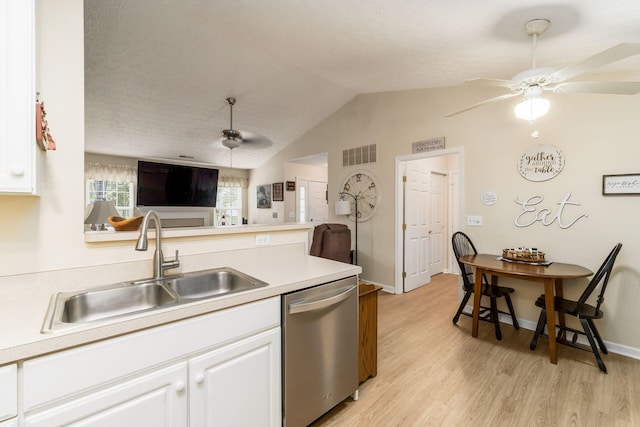 6621 Eagle Ridge Ln Unit 9C, Canal Winchester, OH 43110 - kitchen featuring stainless steel dishwasher, a ceiling fan, a sink, light wood-style floors, and lofted ceiling