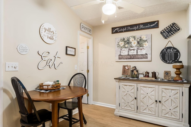 6621 Eagle Ridge Ln Unit 9C, Canal Winchester, OH 43110 - dining area featuring light wood finished floors, ceiling fan, and baseboards