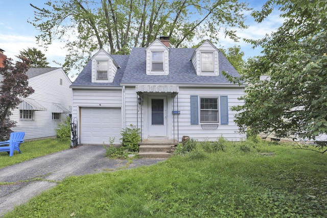 104 W Rathbone Ave, Columbus, OH 43214 - cape cod home with a chimney, roof with shingles, asphalt driveway, and a front lawn