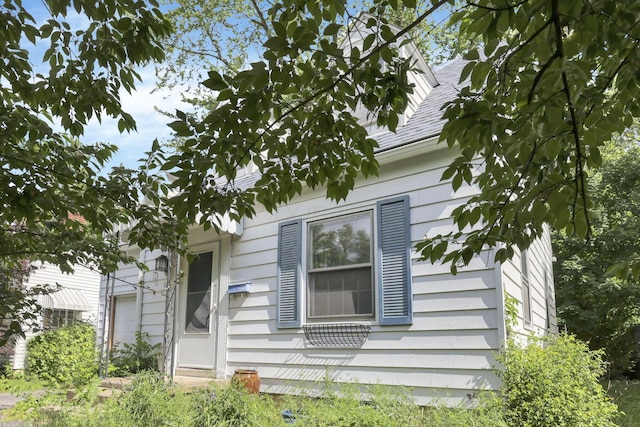 104 W Rathbone Ave, Columbus, OH 43214 - view of home's exterior featuring roof with shingles