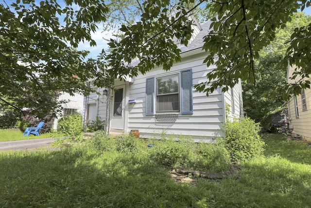 104 W Rathbone Ave, Columbus, OH 43214 - view of property hidden behind natural elements featuring a shingled roof