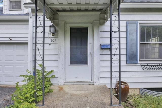 104 W Rathbone Ave, Columbus, OH 43214 - view of exterior entry with a garage