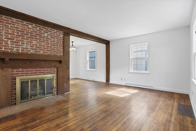 104 W Rathbone Ave, Columbus, OH 43214 - unfurnished living room featuring a baseboard heating unit, wood finished floors, a fireplace, baseboards, and beam ceiling