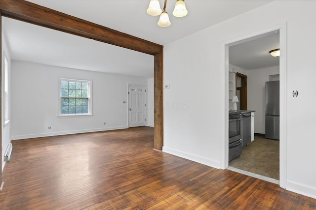 104 W Rathbone Ave, Columbus, OH 43214 - unfurnished room with a chandelier, dark wood-type flooring, and baseboards