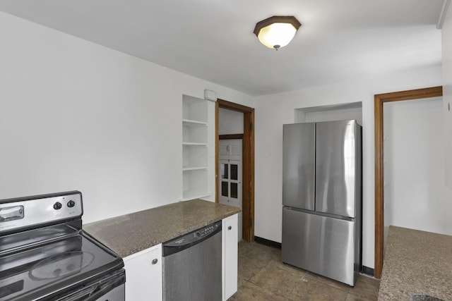 104 W Rathbone Ave, Columbus, OH 43214 - kitchen with stainless steel appliances, dark countertops, and white cabinetry