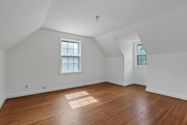 104 W Rathbone Ave, Columbus, OH 43214 - additional living space with wood finished floors, vaulted ceiling, and baseboards