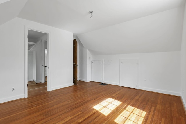 104 W Rathbone Ave, Columbus, OH 43214 - bonus room featuring vaulted ceiling, wood finished floors, and baseboards