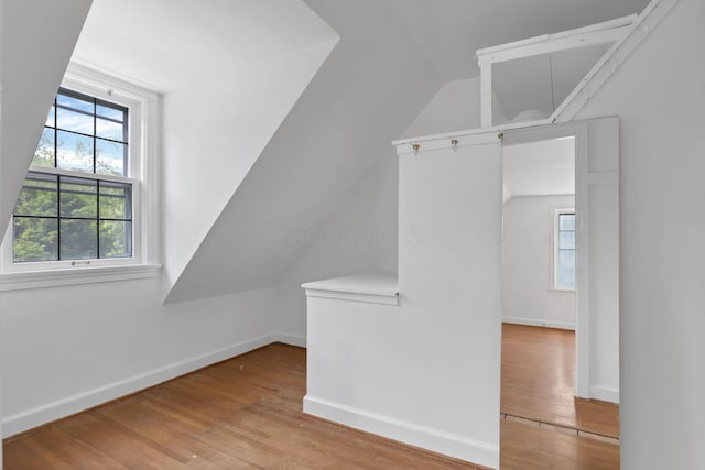 104 W Rathbone Ave, Columbus, OH 43214 - additional living space featuring vaulted ceiling, wood finished floors, plenty of natural light, and baseboards