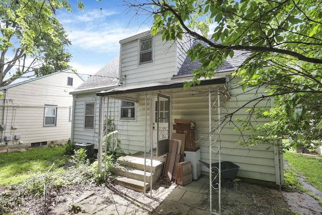 104 W Rathbone Ave, Columbus, OH 43214 - rear view of house with a shingled roof and cooling unit