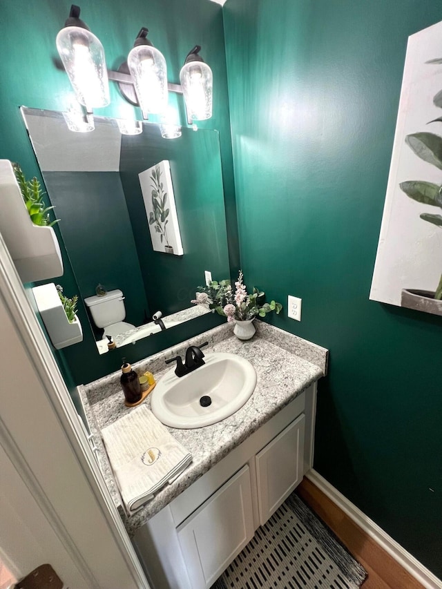 324 Genoa Rd, Commercial Point, OH 43116 - bathroom with vanity, toilet, and baseboards