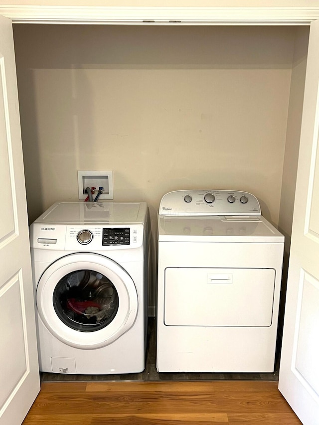 324 Genoa Rd, Commercial Point, OH 43116 - washroom featuring independent washer and dryer and wood finished floors