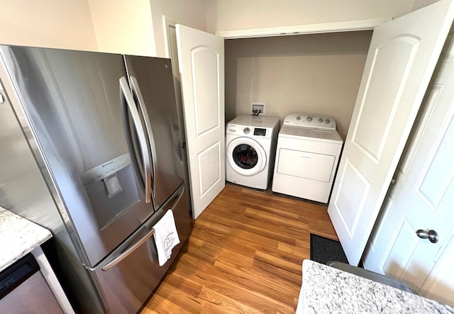 324 Genoa Rd, Commercial Point, OH 43116 - laundry room with washer and clothes dryer and light wood-type flooring