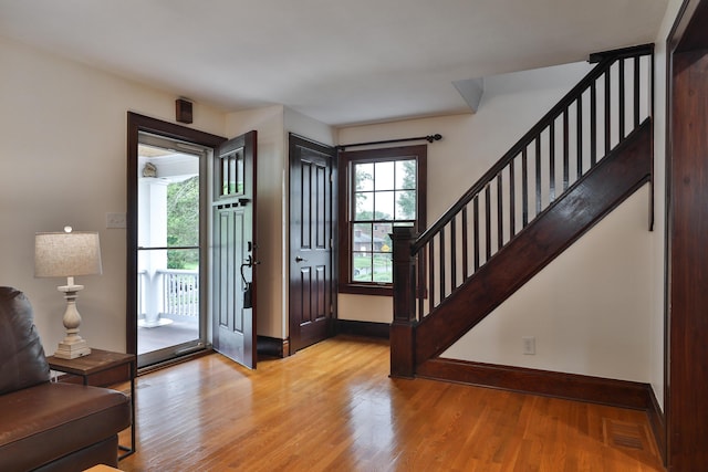 72 Glenmont Ave, Columbus, OH 43214 - entrance foyer with wood finished floors, stairway, and baseboards