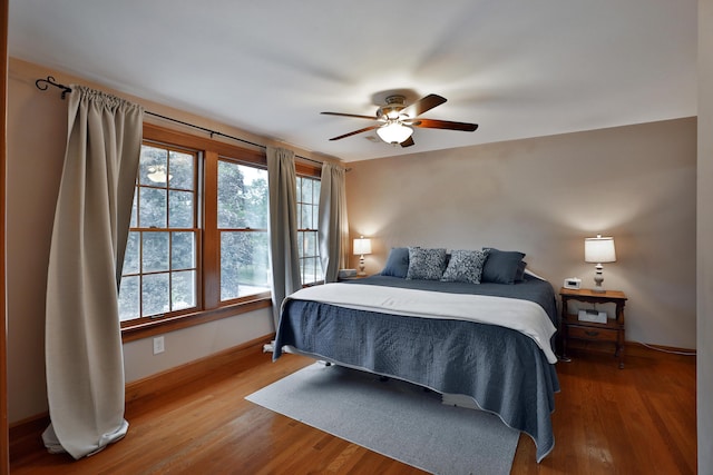 72 Glenmont Ave, Columbus, OH 43214 - bedroom with wood finished floors, baseboards, and ceiling fan