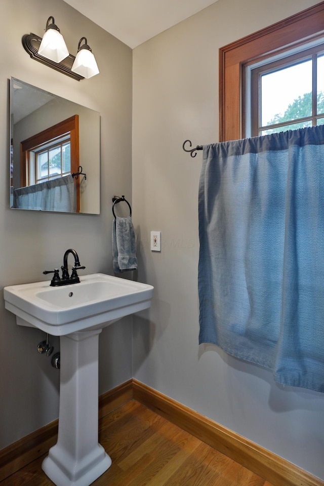 72 Glenmont Ave, Columbus, OH 43214 - bathroom with wood finished floors, baseboards, and a sink