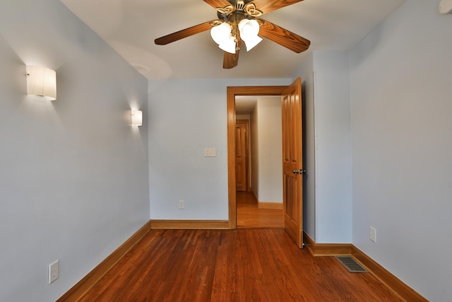 72 Glenmont Ave, Columbus, OH 43214 - unfurnished room featuring a ceiling fan, baseboards, and dark wood-type flooring