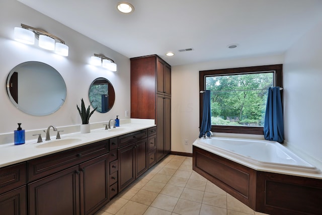 72 Glenmont Ave, Columbus, OH 43214 - full bath featuring double vanity, a bath, tile patterned flooring, and recessed lighting