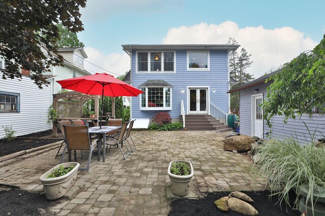 72 Glenmont Ave, Columbus, OH 43214 - rear view of house with french doors, a patio area, entry steps, and outdoor dining space