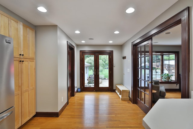 72 Glenmont Ave, Columbus, OH 43214 - foyer entrance with french doors, light wood finished floors, recessed lighting, and baseboards