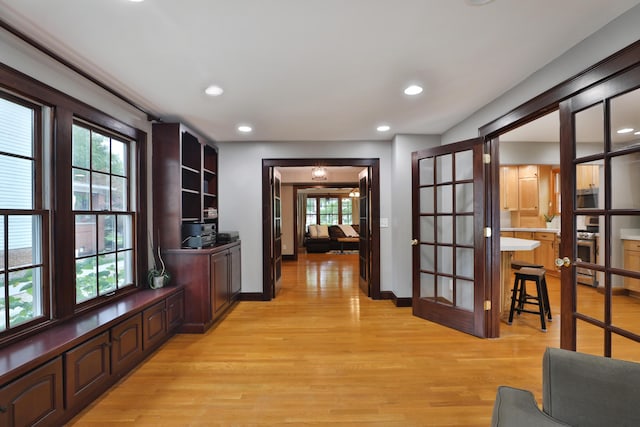 72 Glenmont Ave, Columbus, OH 43214 - hall with light wood-style flooring, french doors, recessed lighting, and baseboards