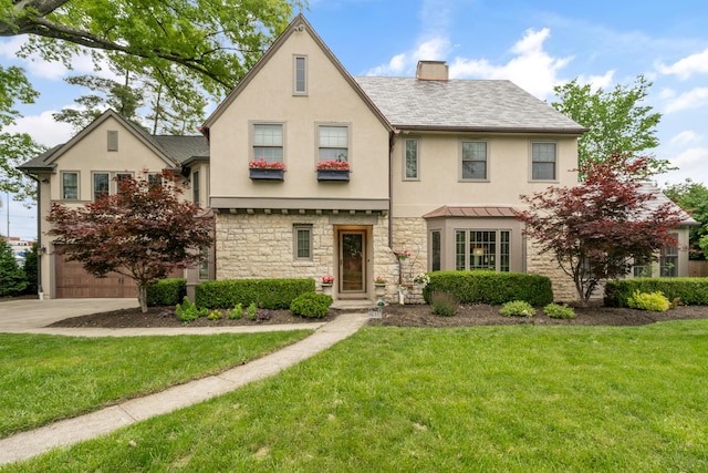 2656 Fair Ave, Columbus, OH 43209 - view of front of house featuring stucco siding, a chimney, and a front yard