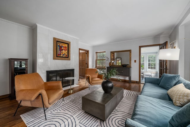 2656 Fair Ave, Columbus, OH 43209 - living area with a tiled fireplace, healthy amount of natural light, wood finished floors, crown molding, and baseboards