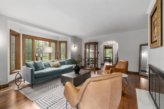 2656 Fair Ave, Columbus, OH 43209 - living area featuring a chandelier, healthy amount of natural light, baseboards, wood finished floors, and crown molding