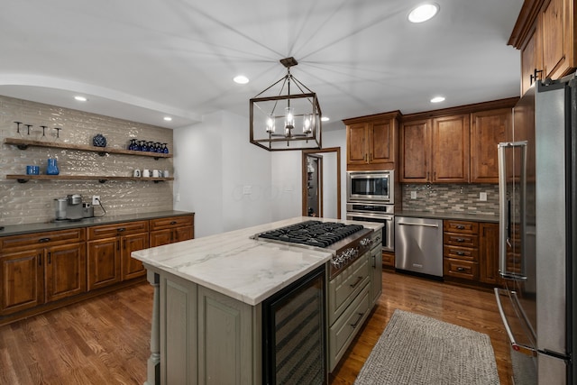 2656 Fair Ave, Columbus, OH 43209 - kitchen featuring appliances with stainless steel finishes, decorative backsplash, beverage cooler, dark wood finished floors, and recessed lighting