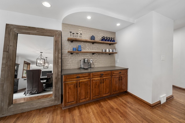 2656 Fair Ave, Columbus, OH 43209 - indoor dry bar with wood finished floors, backsplash, baseboards, and recessed lighting