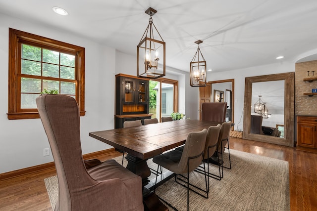 2656 Fair Ave, Columbus, OH 43209 - dining area featuring a chandelier, wood finished floors, recessed lighting, and baseboards